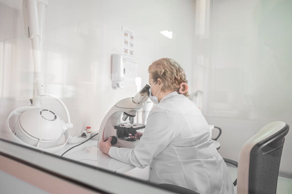 Laboratory scientist conducting mold testing and microscopic analysis